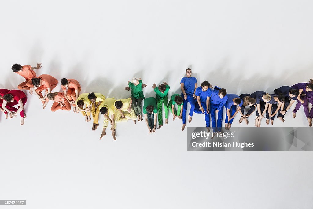 Group of People Casually Reclining on Studio Floor