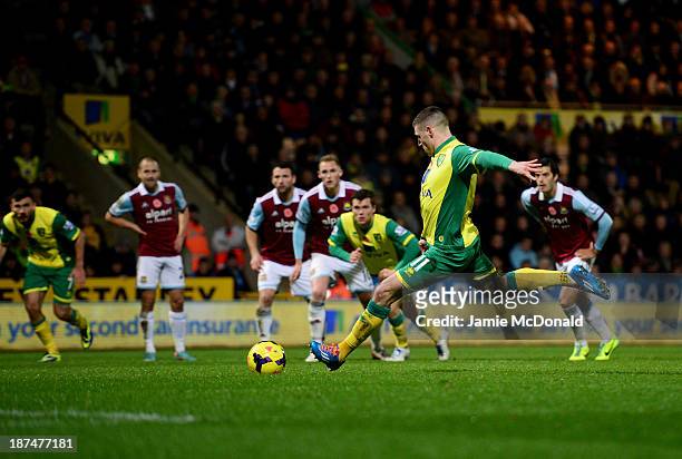 Gary Hooper of Norwich City scores their first goal from the penalty spot during the Barclays Premier League match between Norwich City and West Ham...