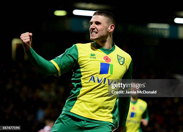 Gary Hooper of Norwich City celebrates as he scores their first goal from the penalty spot during the Barclays Premier League match between Norwich...