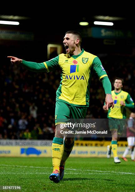 Gary Hooper of Norwich City celebrates as he scores their first goal from the penalty spot during the Barclays Premier League match between Norwich...