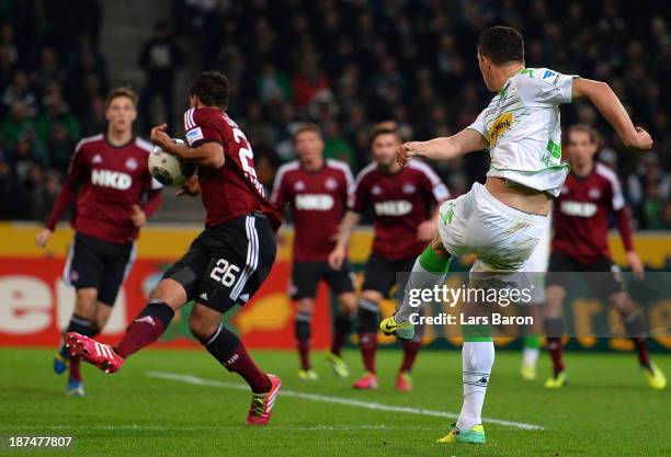 Timothy Chandler of Nuernberg blocks Granit Xhaka of Moenchngladbach during the Bundesliga match between Borussia Moenchengladbach and 1. FC...