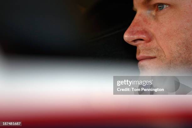Dale Earnhardt Jr., driver of the National Guard Chevrolet, looks on during practice for the NASCAR Sprint Cup Series AdvoCare 500 at Phoenix...
