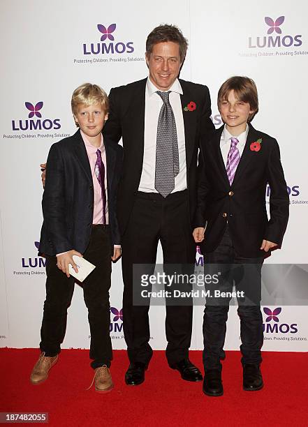 Hugh Grant and Damian Hurley, son of Elizabeth Hurley, attend the Lumos fundraising event hosted by J.K. Rowling at The Warner Bros. Harry Potter...