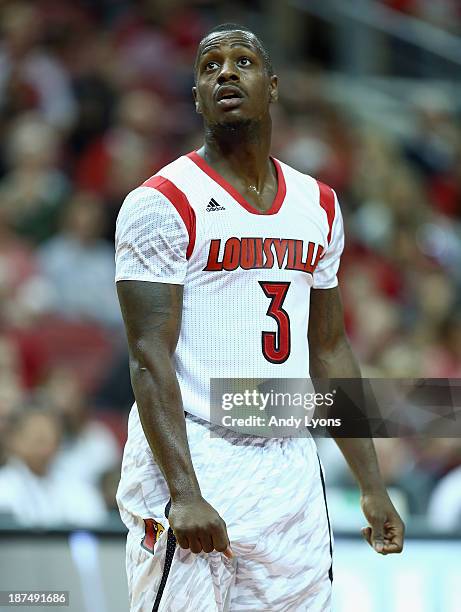 Chris Jones of the Louisville Cardinals watches the action during the game against the College of Charleston Cougars at KFC YUM! Center on November...