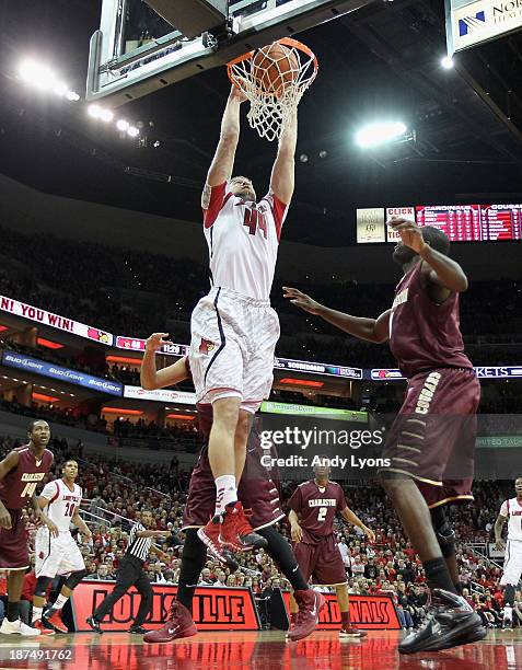 Stephan Van Treese of the Louisville Cardinals dunks the ball during the game against the College of Charleston Cougars at KFC YUM! Center on...