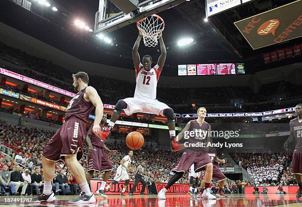 Mangok Mathiang of the Louisville Cardinals dunks the ball during the game against the College of Charleston Cougars at KFC YUM! Center on November...