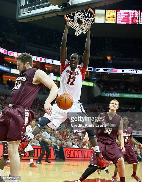 Mangok Mathiang of the Louisville Cardinals dunks the ball during the game against the College of Charleston Cougars at KFC YUM! Center on November...