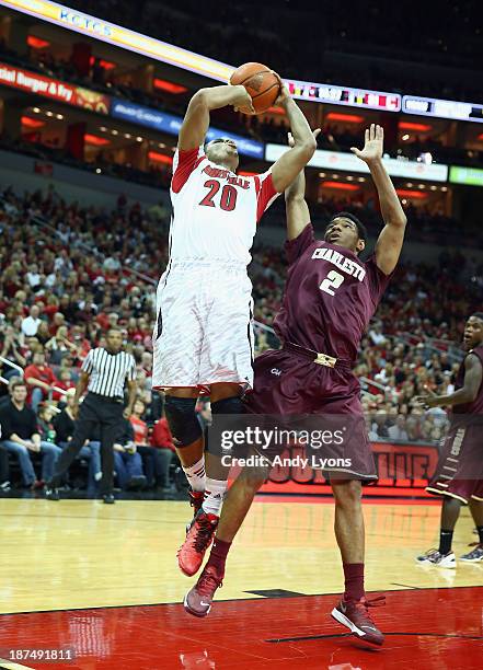 Wayne Blackshear of the Louisville Cardinals shoots the ball while defended by Johnathan Burroughs-Cook of the College of Charleston Cougars at KFC...