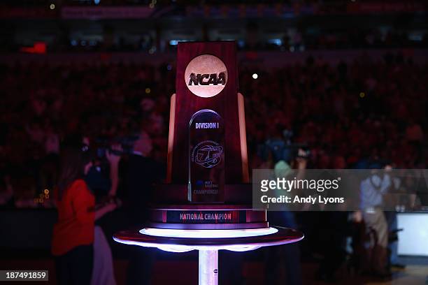 The 2013 NCAA National Championship trophy sits a half court before the Louisville Cardinals game against the College of Charleston Cougars at KFC...