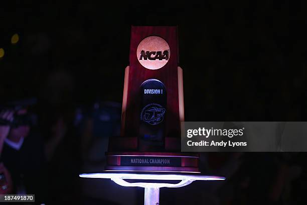 The 2013 NCAA National Championship trophy sits a half court before the Louisville Cardinals game against the College of Charleston Cougars at KFC...