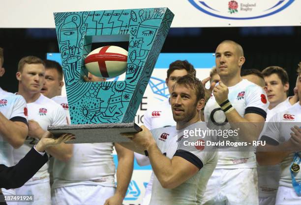 Chris Robshaw, the England captain raise the trophy after their victory during the QBE International match between England and Argentina at...