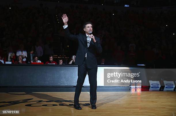 Rick Pitino the head coach of the Louisville Cardinals talks to the crowd before the game against the College of Charleston Cougars at KFC YUM!...