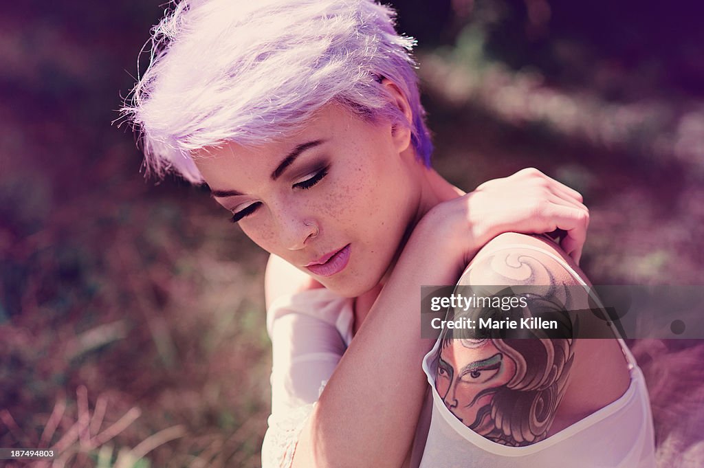 Portrait of girl with lavender hair and tattoos