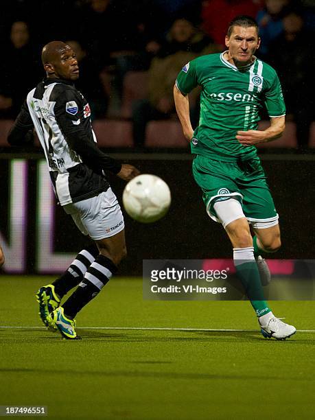Kwame Quansah of Heracles, Andraz Kirm of FC Groningen during the Eredivisie match between Heracles Almelo and FC Groningen on November 09, 2013 at...