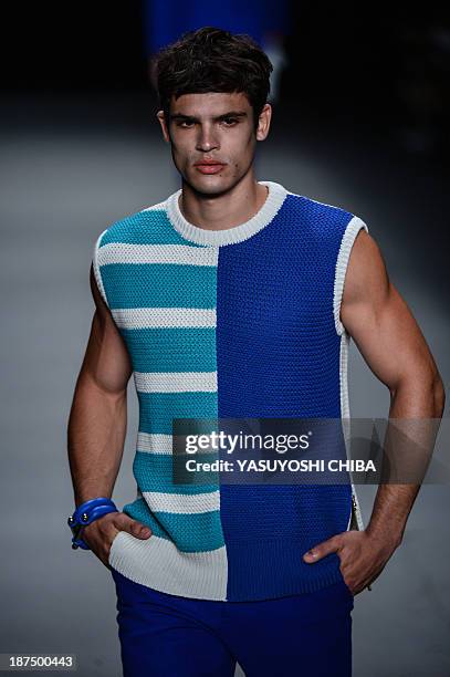 Model presents a creation by R.Groove during the 2014 Winter collection of Fashion Rio in Rio de Janeiro, Brazil, on November 9, 2013 AFP PHOTO /...