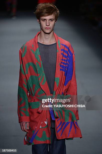 Model presents a creation by R.Groove during the 2014 Winter collection of Fashion Rio in Rio de Janeiro, Brazil, on November 9, 2013 AFP PHOTO /...