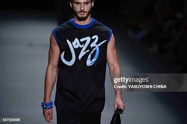 Model presents a creation by R.Groove during the 2014 Winter collection of Fashion Rio in Rio de Janeiro, Brazil, on November 9, 2013 AFP PHOTO /...