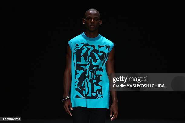 Model presents a creation by R.Groove during the 2014 Winter collection of Fashion Rio in Rio de Janeiro, Brazil, on November 9, 2013 AFP PHOTO /...