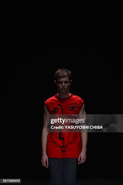 Model presents a creation by R.Groove during the 2014 Winter collection of Fashion Rio in Rio de Janeiro, Brazil, on November 9, 2013 AFP PHOTO /...