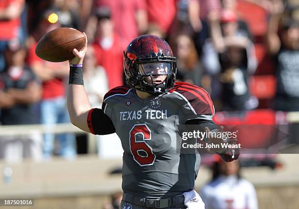 Baker Mayfield of the Texas Tech Red Raiders throws a pass during game action against the Kansas State Wildcats on November 9, 2013 at AT&T Jones...