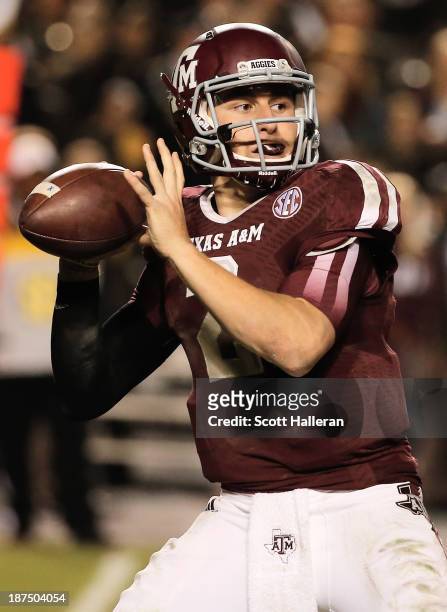 Johnny Manziel of the Texas A&M Aggies drops back to pass in the fourth quarter during the game against the Mississippi State Bulldogs at Kyle Field...