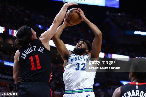 Jaime Jaquez Jr. #11 of the Miami Heat blocks a shot by Karl-Anthony Towns of the Minnesota Timberwolves during the first quarter of the game at...