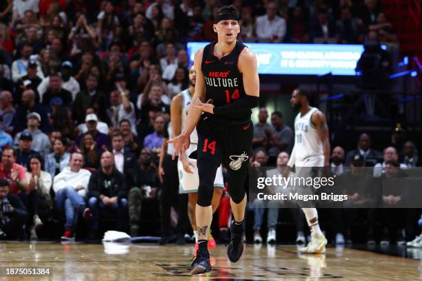 Tyler Herro of the Miami Heat reacts after making a basket against the Minnesota Timberwolves at Kaseya Center on December 18, 2023 in Miami,...