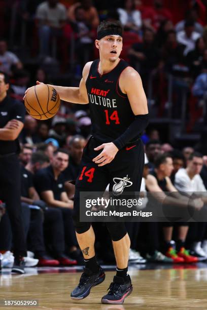 Tyler Herro of the Miami Heat dribbles the ball against the Minnesota Timberwolves during the third quarter of the game at Kaseya Center on December...