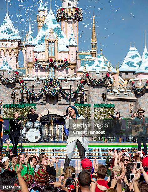 Demi Lovato performs 'Let it Go' from the upcoming animated feature, 'Frozen,' during a taping for the 'Disney Parks Christmas Day Parade' television...