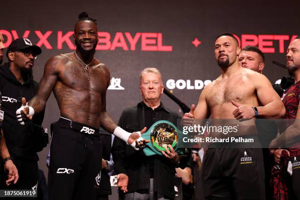 Deontay Wilder and Joseph Parker react after facing off ahead of their Heavyweight fight during the Day of Reckoning: Weigh-In on December 22, 2023...