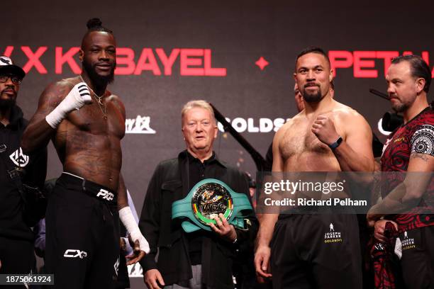 Deontay Wilder and Joseph Parker react after facing off ahead of their Heavyweight fight during the Day of Reckoning: Weigh-In on December 22, 2023...