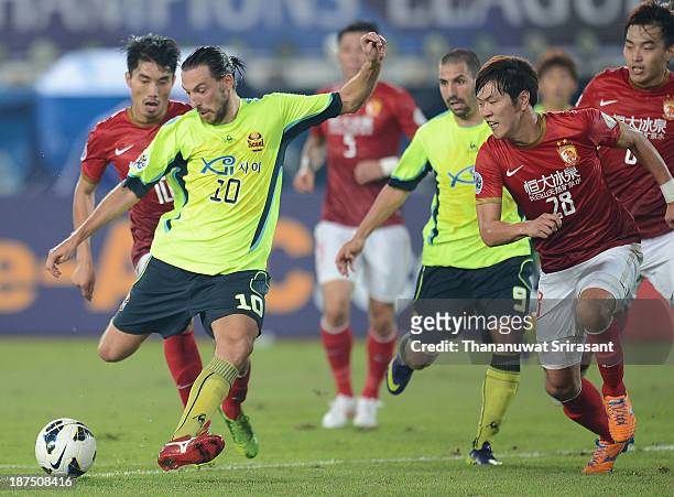 Dejan Damjanovic of FC Seoul competes for the ball with Kim Yong Gwon of Guangzhou Evergrande during the AFC Champions League Final 2nd leg match...