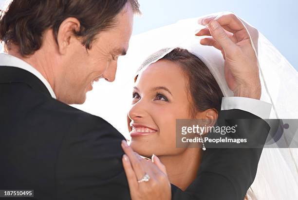 unveiling his new wife - looking over his shoulder stockfoto's en -beelden