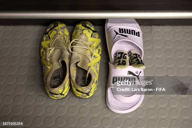 The boots and shin pads of Jack Grealish are seen inside the Manchester City dressing room prior to the FIFA Club World Cup Saudi Arabia 2023 Final...