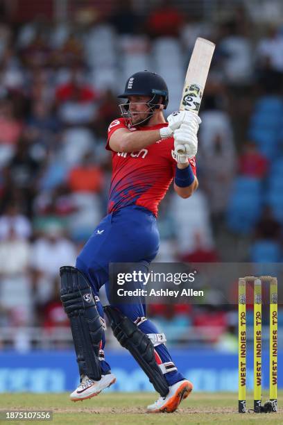 Liam Livingstone of England hits four runs during the 5th T20 International between the West Indies and England at the Brian Lara Cricket Academy on...