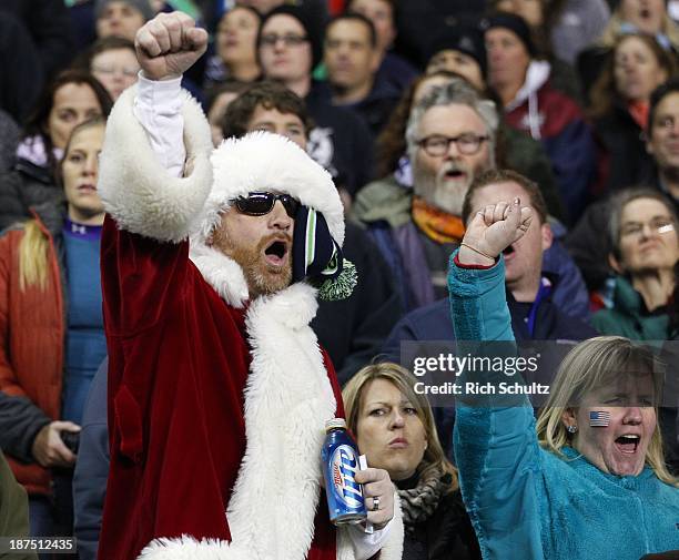 Fan dressed as Santa Claus cheers during the pre-match introductions before the New Zealand Maori All Blacks play the USA Eagles in a test match at...