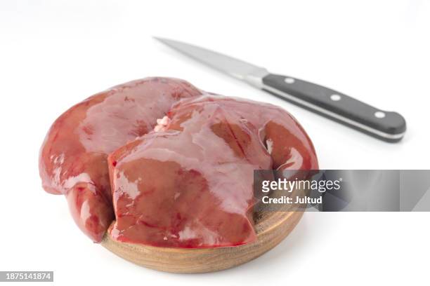 whole raw lamb liver, on wooden board. isolated on white background - liver offal stock pictures, royalty-free photos & images