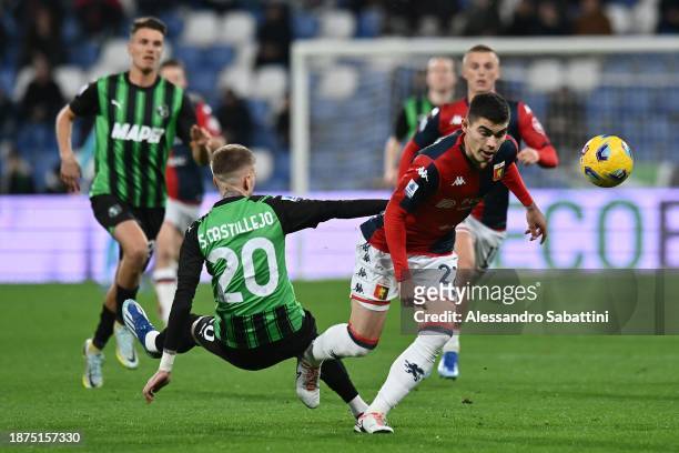 Samu Castillejo of US Sassuolo competes for the ball with Johan Vasquez of Genoa CFC during the Serie A TIM match between US Sassuolo and Genoa CFC...