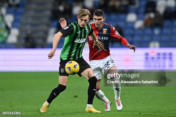 Marcus Pedersen of US Sassuolo competes for the ball with Johan Vasquez of Genoa CFC during the Serie A TIM match between US Sassuolo and Genoa CFC...