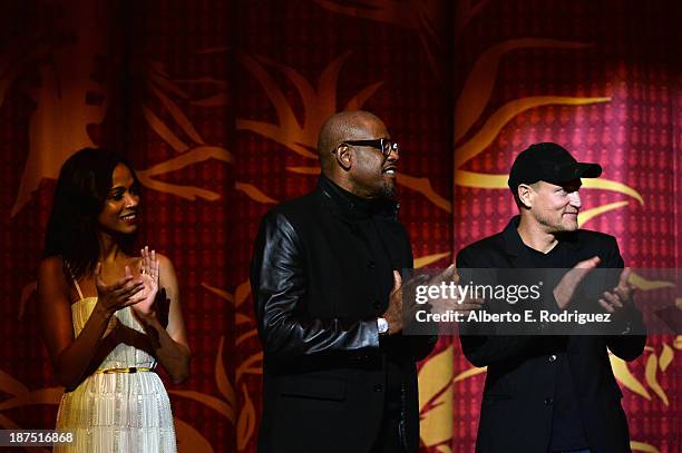 Actress Zoe Saldana, actor Forest Whitaker, and actor Woody Harrelson attend the screening of "Out of the Furnace" during AFI FEST 2013 presented by...