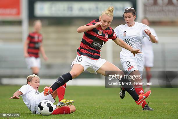 Teigen Allen of the Wanderers is tackled by Kristy Moore of Adelaide during the round one W-League match between the Western Sydney Wanderers and...