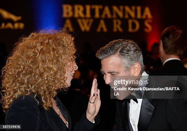 Actors Alex Kingston and George Clooney attend the 2013 BAFTA LA Jaguar Britannia Awards presented by BBC America at The Beverly Hilton Hotel on...