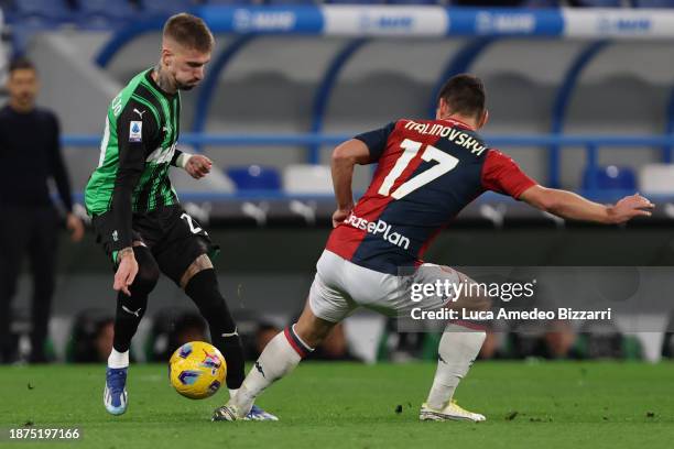 Samu Castillejo of US Sassuolo competes for the ball with Ruslan Malinovskyi of Genoa CFC during the Serie A TIM match between US Sassuolo and Genoa...