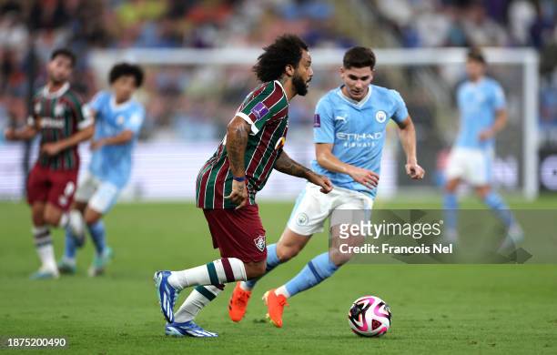 Marcelo of Fluminense runs with the ball whilst under pressure from Julian Alvarez of Manchester City during the FIFA Club World Cup Saudi Arabia...