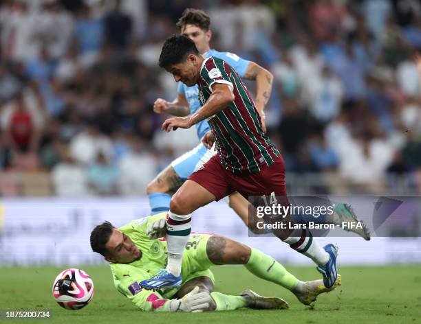 German Cano of Fluminense is challenged by Ederson of Manchester City during the FIFA Club World Cup Saudi Arabia 2023 Final between Manchester City...