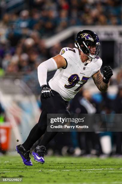Brent Urban of the Baltimore Ravens steps up to block during an NFL football game against the Jacksonville Jaguars at EverBank Stadium on December...