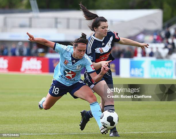 Emma Kete of Sydney FC is challenged by Alexandra Natoli of the Victory during the round one W-League match between the Melbourne Victory and Sydney...