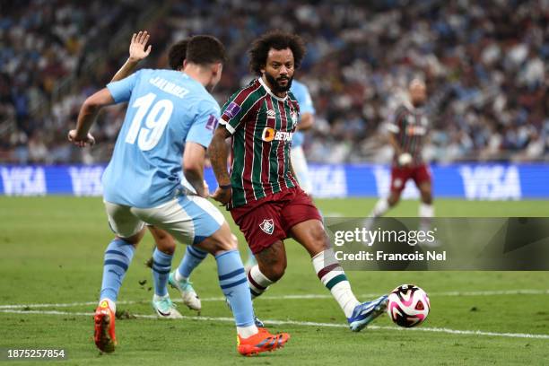 Marcelo of Fluminense passes the ball whilst under pressure from Julian Alvarez of Manchester City during the FIFA Club World Cup Saudi Arabia 2023...