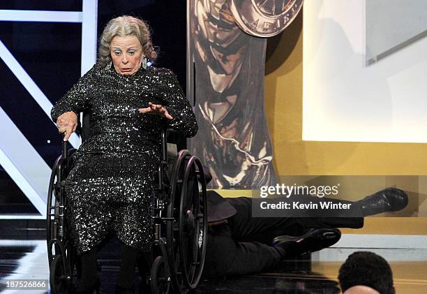 Actor Sacha Baron Cohen , recipient of the Charlie Chaplin Britannia Award for Excellence in Comedy, and stunt performer onstage during the 2013...