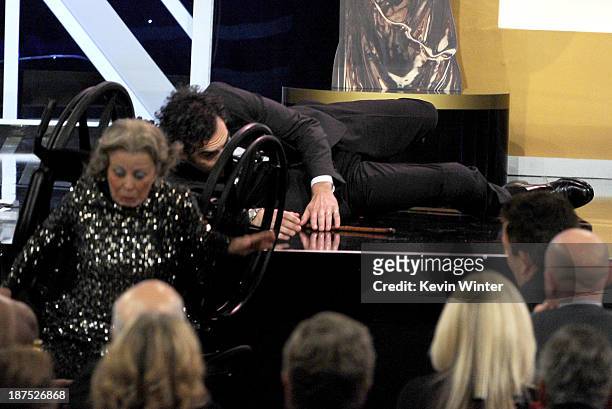 Actor Sacha Baron Cohen , recipient of the Charlie Chaplin Britannia Award for Excellence in Comedy, and stunt performer onstage during the 2013...
